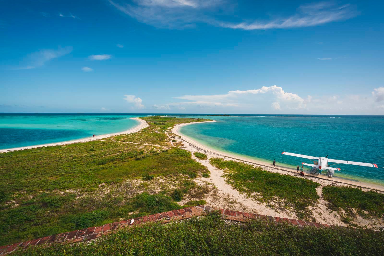 An aerial view of the historic Fort Jefferson surrounded by clear turquoise water in Dry Tortugas National Park.
