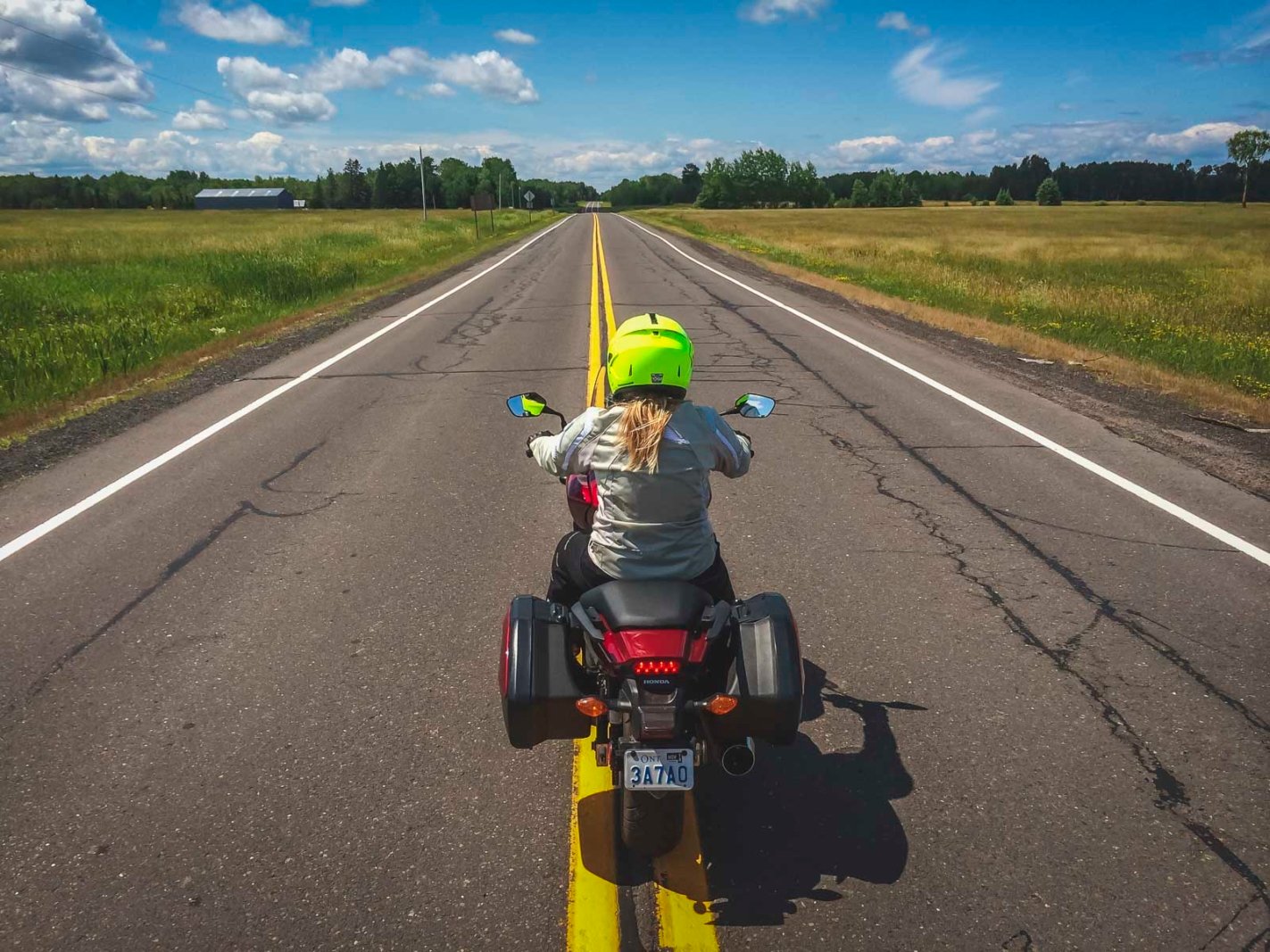 Deb on a motorcycle driving down the scenic US-2 highway in Lake Michigan in the Upper Peninsula.