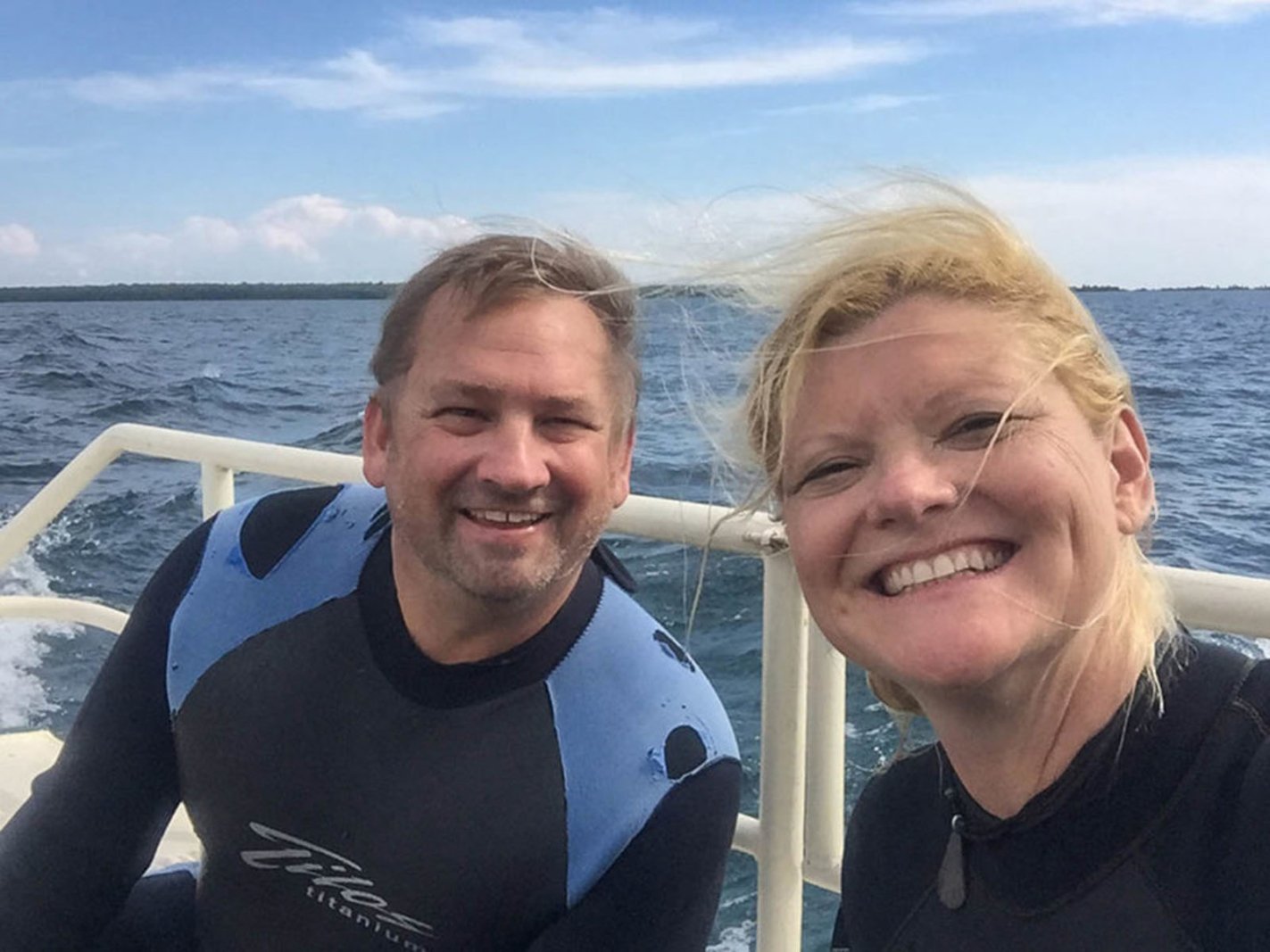 Dave and Deb about to go scuba diving one of the best things to do in the Upper Peninsula, Michigan