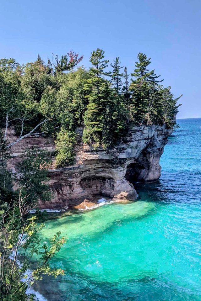 the turquoise water of Lake Superior below the stunning cliffs of Pictured Rocks National Lakeshore.