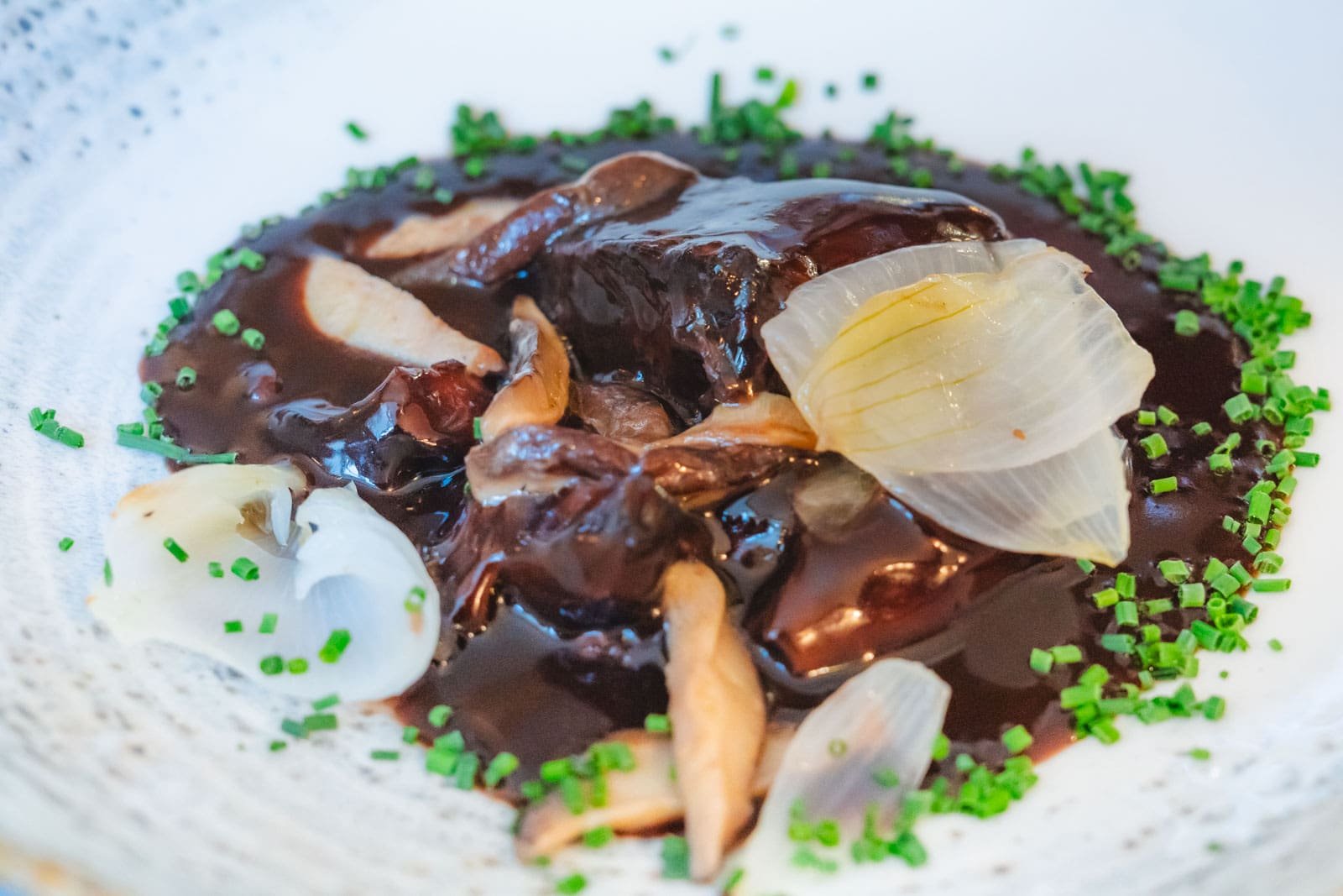 he rich, dark Coq au Vin we were served in a traditional bouchon in Lyon, a classic French dish