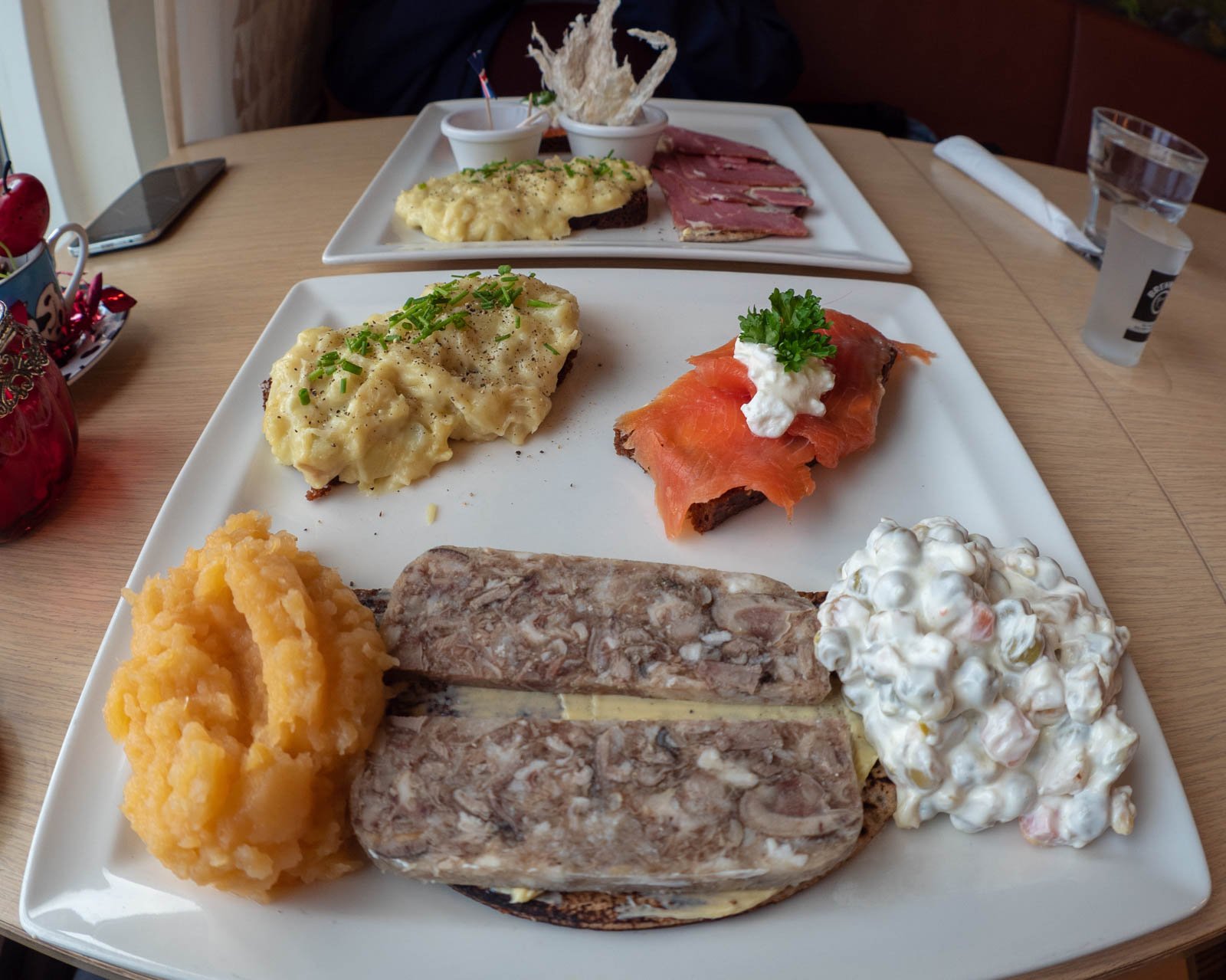 Traditional Icelandic food spread with plokkfiskur, skyr, pylsur, rye bread, and humar in Reykjavík, Iceland.