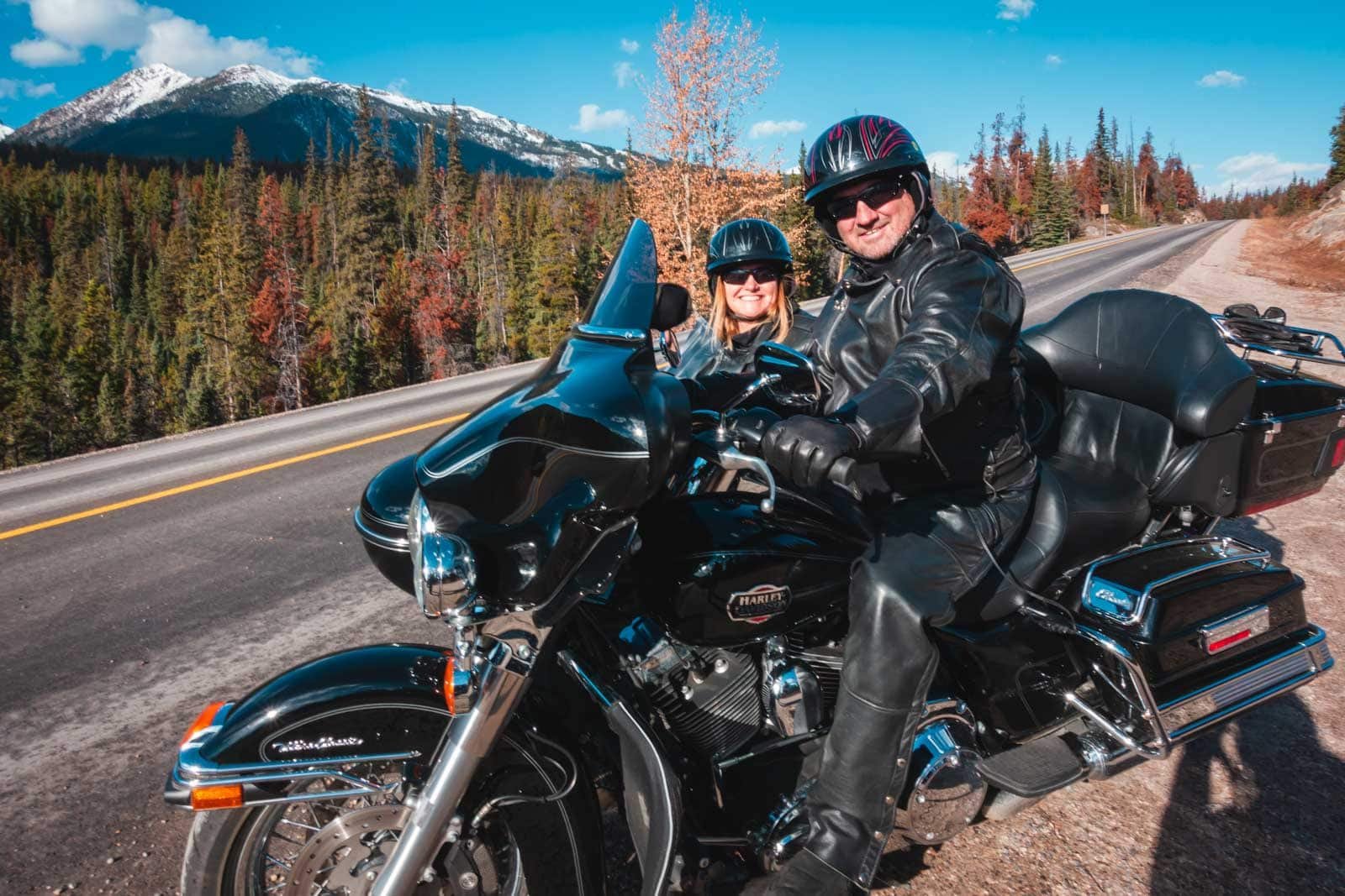 Dave from The Planet D smiling and giving a thumbs-up from the sidecar of a motorcycle tour in Jasper National Park.