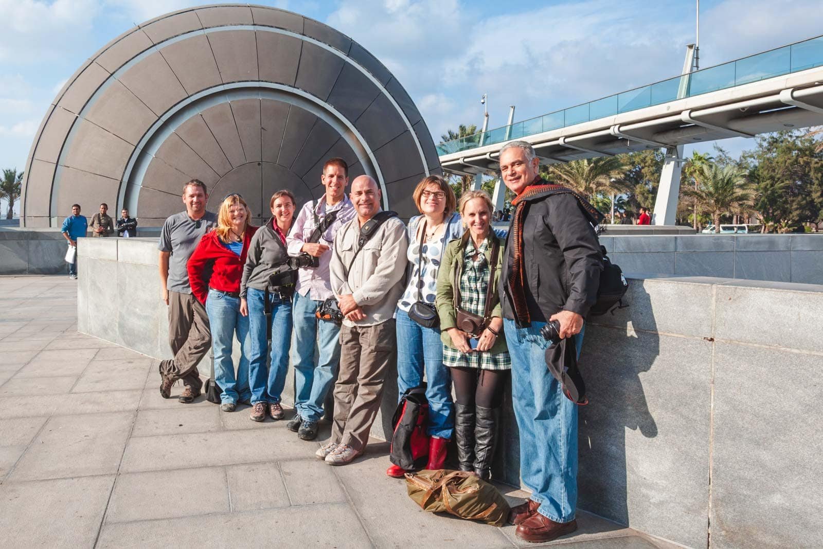 our small tour group listening to our Egyptologist guide in Cairo, Egypt, showing the benefit of a guided tour for safety and context.